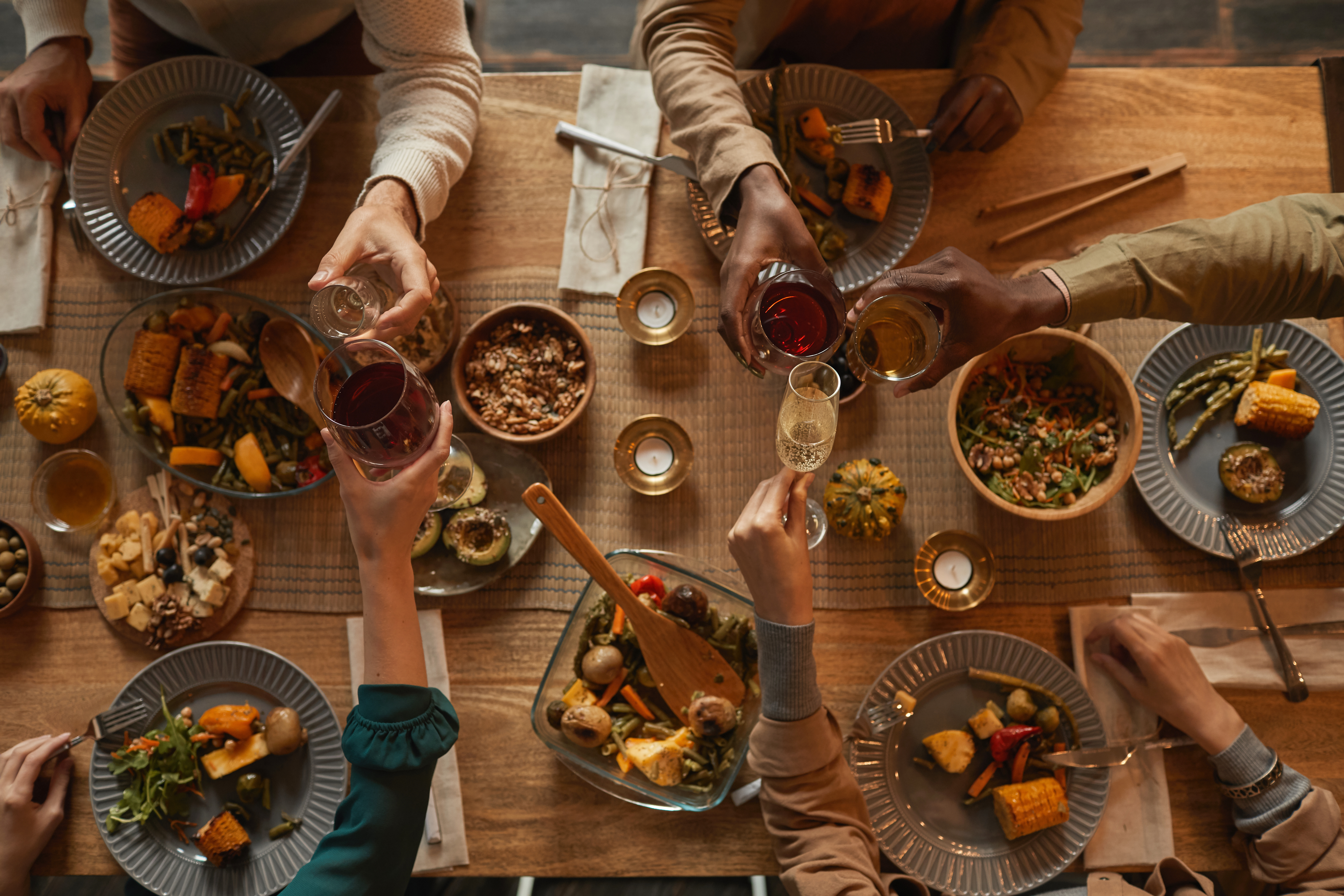 A table filled with healthy, delicious food at a dinner party - learn how to cook for a dinner party with The Real Food Academy Miami!
