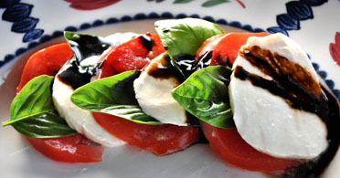 The Real Food Academy Tampa caprese salad course with tomatoes and cheese.