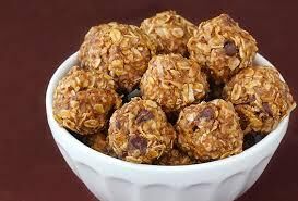 The Real Food Academy power energy balls on a pink plate.